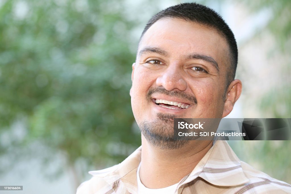 Handsome Hispanic Male Having A Laugh A Hispanic male laughing.See more from this series: Adult Stock Photo