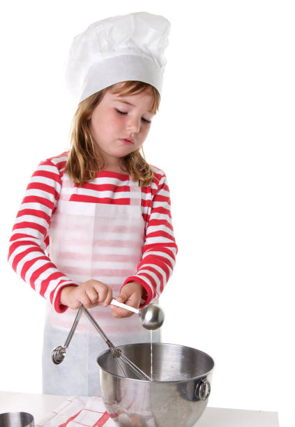 istock Junior Cook Series - Pouring Milk into Mixing Bowl 173016892