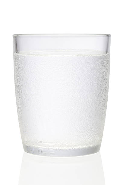 Glass of water with condensation stock photo