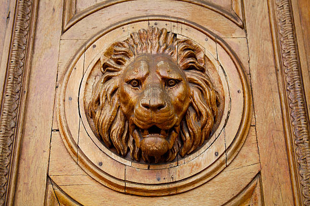 istock Wooden lion head 173018100