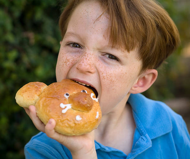 istock Boy Freckle Face, Redhead Child Eating Breakfast Bread Brioche Bun 173018436