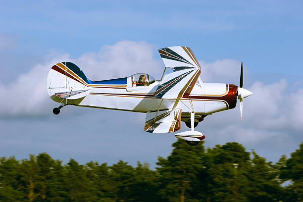 Airplane doing low fly by stock photo