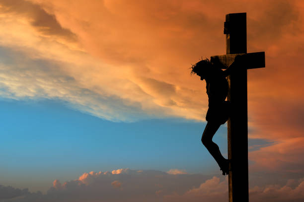 Jesus Crucifixion A crucifix silhouette set against a dramatic sky.PLEASE CLICK ON THE IMAGE BELOW TO SEE MY EASTER PORTFOLIO: the crucifixion photos stock pictures, royalty-free photos & images