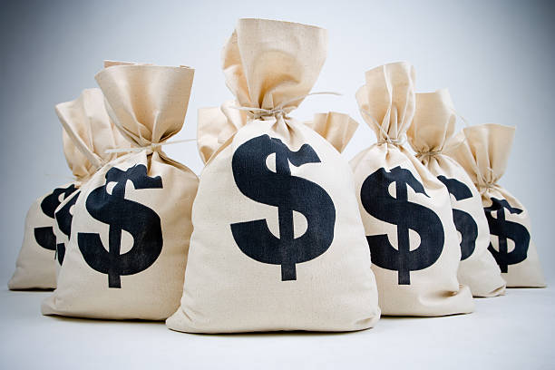 lot of money bags  money bag stock pictures, royalty-free photos & images