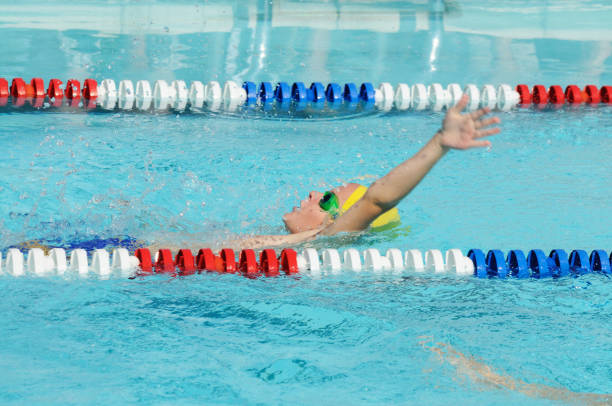 istock Young Male Athlete Swimming Backstroke in Race 173019102
