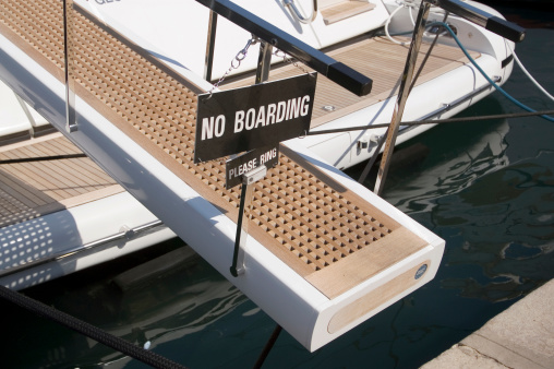No boarding sign on a luxury boat in the harbor of Saint Tropez, France