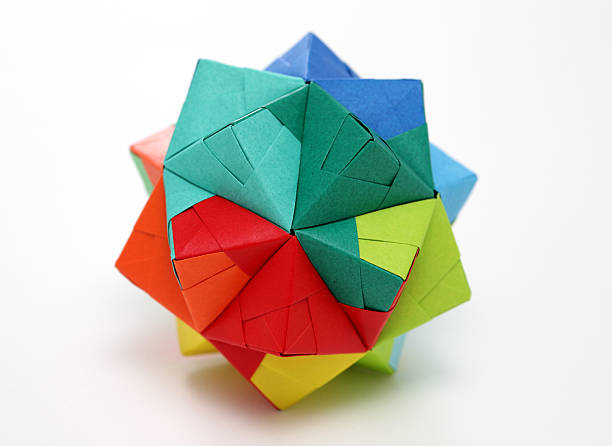 Multicolored geometric origami polyhedron isolated on white More Origami and Paper Creations polyhedron stock pictures, royalty-free photos & images