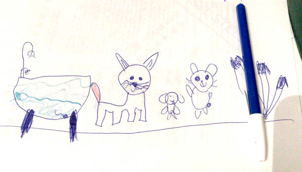 Above shot of mother and children drawing with crayons on a paper in the living room