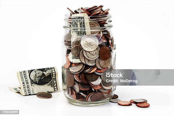 Jar Of Money Overflowing With Coins And Currency Stock Photo - Download Image Now - Tip Jar, US Currency, American One Dollar Bill