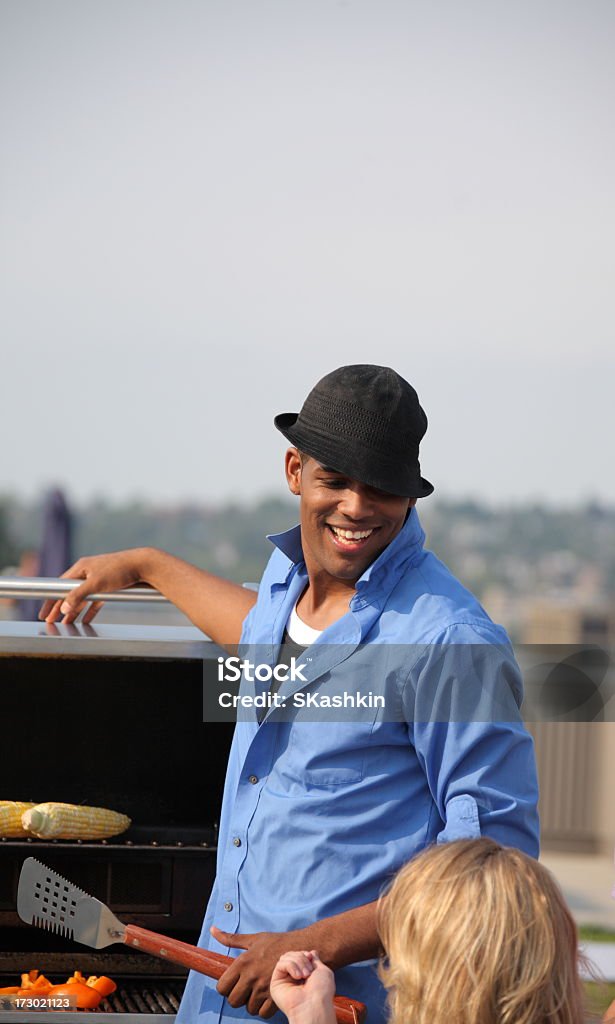Young guy beside Grill African Ethnicity Stock Photo