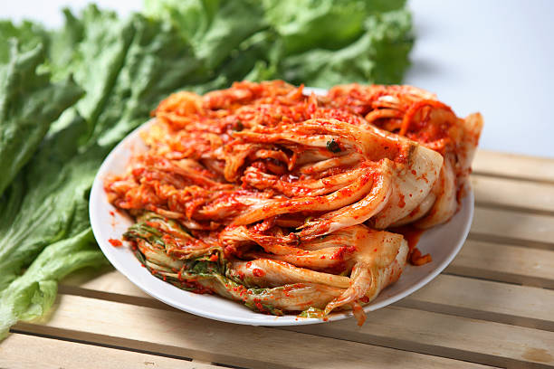Kimchi dish served on a white plate Spicy Korean Kimchee cayenne powder photos stock pictures, royalty-free photos & images