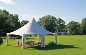 Small Marquee Tent with picnic tables in a park
