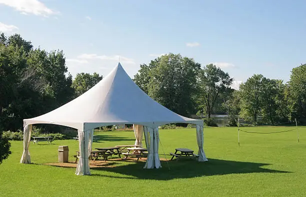 Photo of Small Marquee Tent with picnic tables in a park