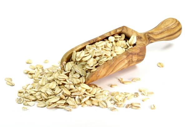 istock wooden scoop with oatmeal 1730216179