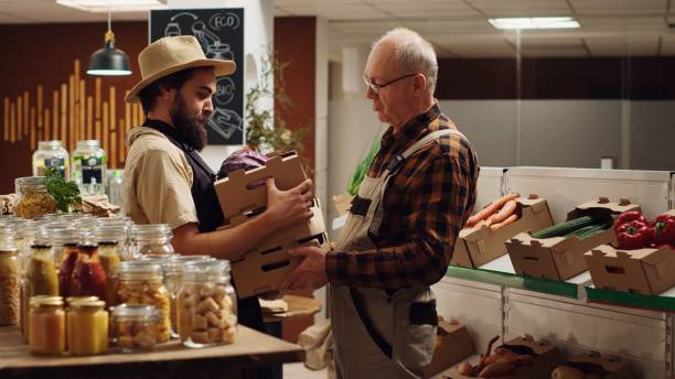 istock Farmer refills supermarket with veggies 1730218854