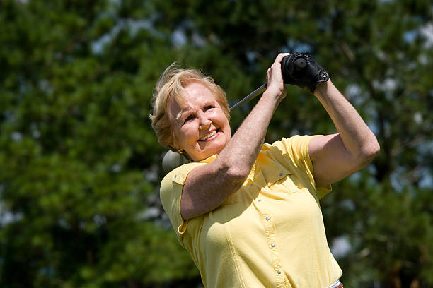 Portrait Of A Female Golfer smiling at camera 