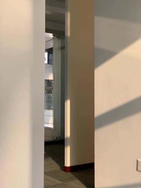 The narrow gap between walls, with sunset on the wall