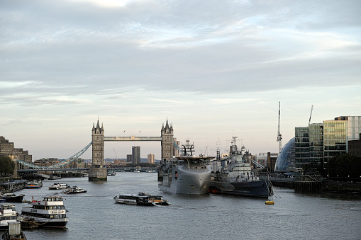 RFA Proteus next to HMS Belfast is a Multi-Role Ocean Surveillance Ship (MROSS) and the Tower Bridge behind.