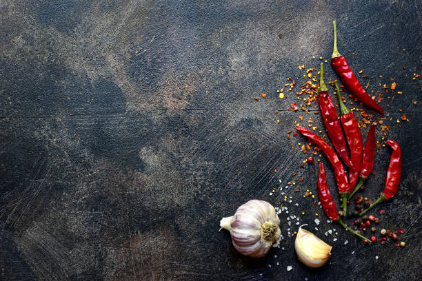istock Chili pepper and garlic. Top view with copy space. 1730226303