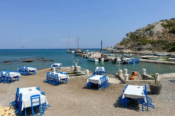 istock Typically Greek blue restaurant table and chairs beside the sea 1730226826