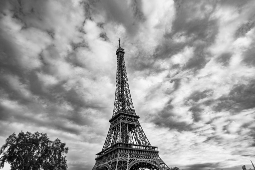 Eiffel Tower with a moody sky in black & white at dusk, Paris, France