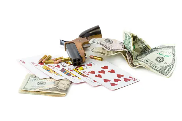 Photo of Money, cards and derringer handgun