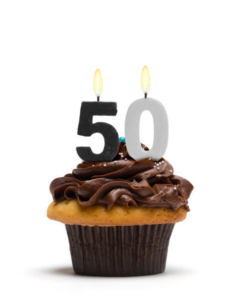 Fiftieth Birthday Cupcake An over-the-hill cupcake featuring somber gray-and-black candles displaying the number 50.More cupcakes: fiftieth stock pictures, royalty-free photos & images