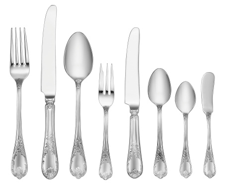 A lot of silver forks and spoons with antique patterns on a white surface