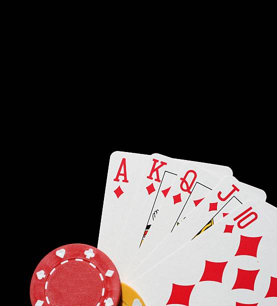 Rolling casino dice on the green poker table in the las vegas with golden chips on the table. Thrown jackpot with number six on all five dices. Entertainment and nightlife in vegas. Background