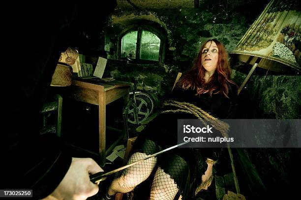 Young Woman Tied To Chair With Mans Hand Holding Knife Stock Photo - Download Image Now