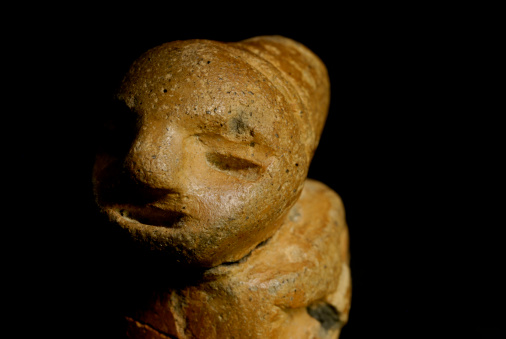 Artifact recovered from banks of Connecticut River, Connecticut, U.S.A., clay effigy likely of Native American origin, surface archaeological find, isolated over black, possibly pre-Columbian, date unknown.