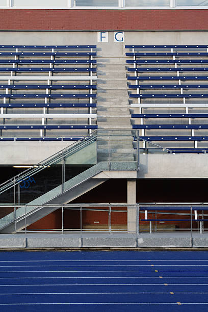 istock Stadium Bleachers With Blue Track Lanes 173025615