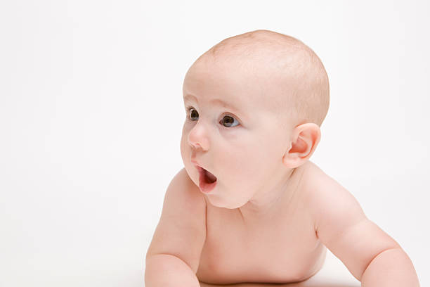 istock surprised looking baby with open mouth on plain background 173025804