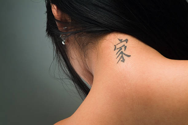 Sexy tattoo on neck Pretty neck with chinese tatoo back shoulder tattoos for women pictures stock pictures, royalty-free photos & images