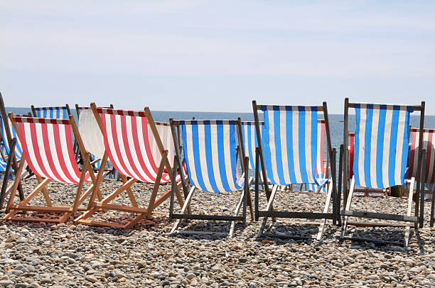 istock Beachchairs in a row at sea 173025849