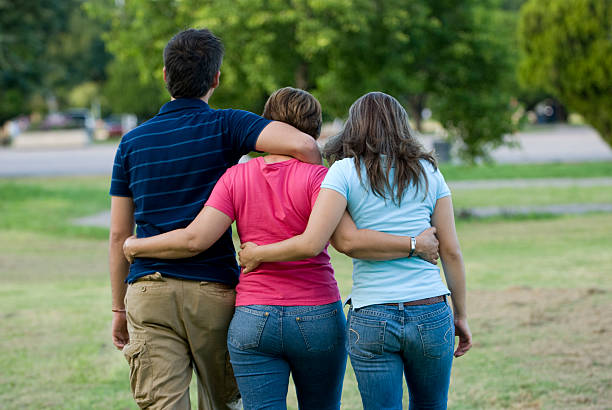 istock family walking in the park 173026784