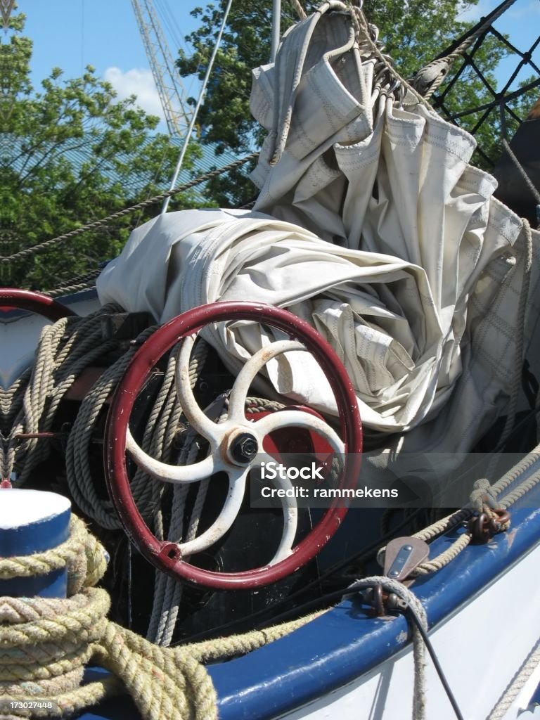 Traditional Dutch sailing boat detail "Detail of a traditional Dutch sailing boat with sail, rope, cleat." Antique Stock Photo