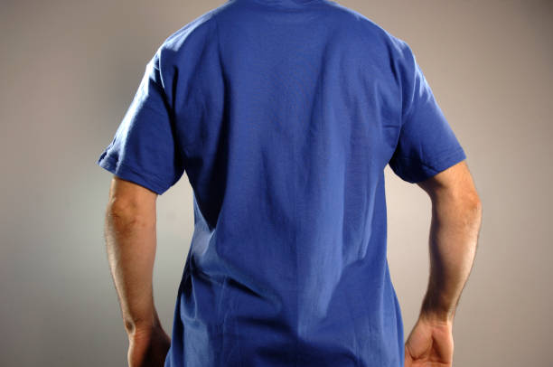istock Rear view of a man's midsection wearing a blue t-shirt. 173028072