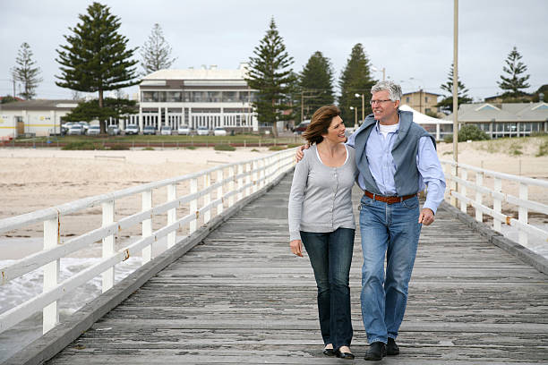 istock Mature heterosexual couple walking on dock 173028583