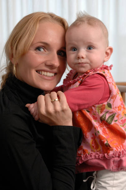 istock smiling mother and baby daughter 173029365