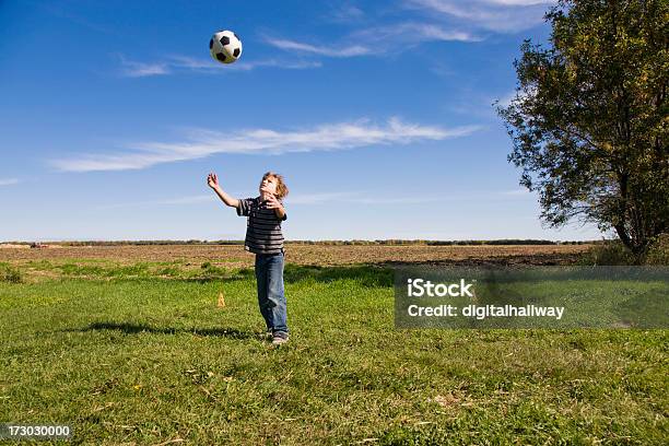 Boy Playing With Soccer Ball Stock Photo - Download Image Now - Yard - Grounds, Child, Playing