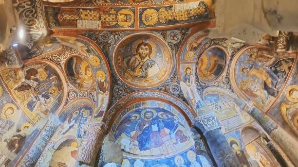 Dark Church at Goreme Open air Museum of Cappadocia Goreme, Cappadocia, Turkey - Aug 4,2023: interior of Dark Church in Goreme Open-Air Museum. Carved into rock, church's interior is adorned with meticulously preserved frescoes of the Byzantine period. uchisar stock pictures, royalty-free photos & images