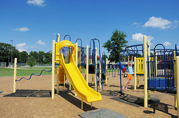 istock Two Children Playing on Playground Equipment 173031432