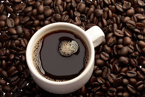 istock Fill white coffee cup on top of coffee beans 173031543