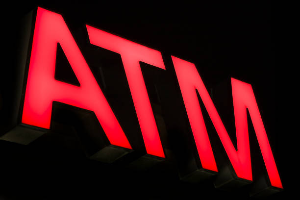 istock red ATM automated teller sign illuminated at night 173031854
