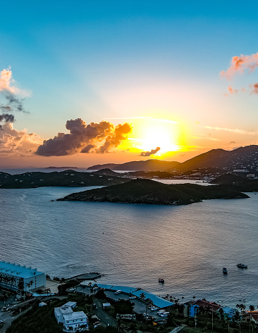 An aerial view of the islands of St. Thomas, Hassel island and Water Island as the sun sets to the west of the US Virgin Islands