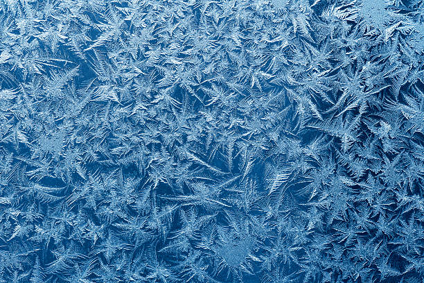 Frosty pattern Beautiful frost pattern on a window. frost stock pictures, royalty-free photos & images