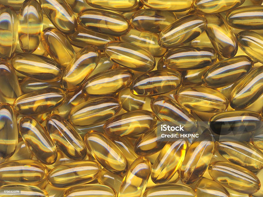 Full Frame cuore sano pillole e capsule di olio di pesce - Foto stock royalty-free di Alimentazione sana
