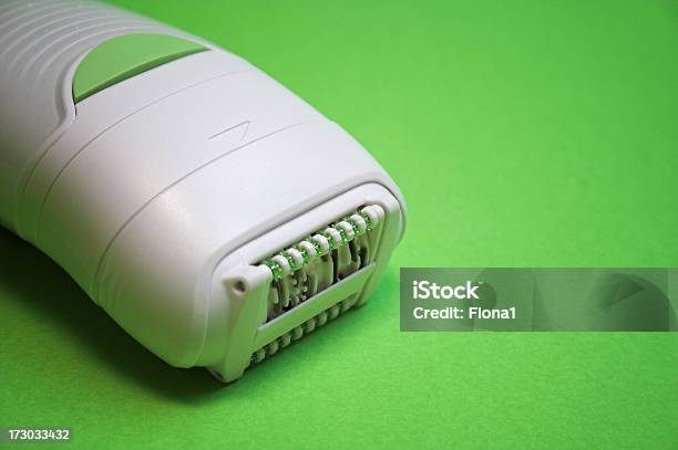 Women Electrical Depilator Isolated On Green Stock Photo - Download Image Now - Adult, Appliance, Beauty