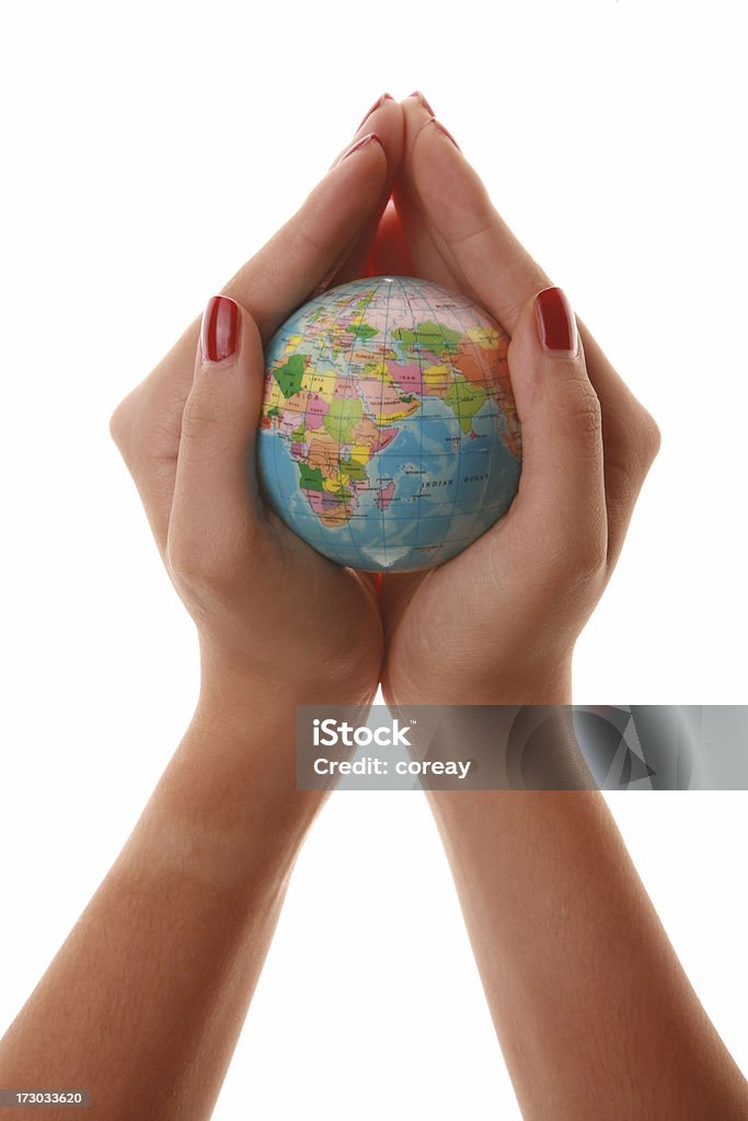 holding the world series globe and woman hand isolated on the white background. Africa Stock Photo